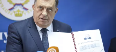 Bosnian Serb political leader Milorad Dodik speaks and shows documents during a press conference in Srebrenica, Bosnia, Thursday, May 23, 2024. Today the United Nations General Assembly will be voting on a draft resolution declaring July 11 the International Day of Reflection and Commemoration of the 1995 genocide in Srebrenica. (AP Photo/Armin Durgut)