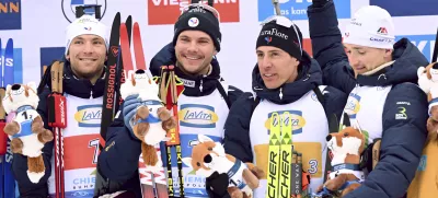 The winning French relay team from left, Emilien Claude, Fabien Claude, Quentin Fillon Maillet and Emilien Jacquelin celebrate on the podium after the men's relay 4 x 7.5 km at the Biathlon World Cup in Ruhpolding, Germany, Friday Jan. 17, 2025. (Sven Hoppe/dpa via AP)