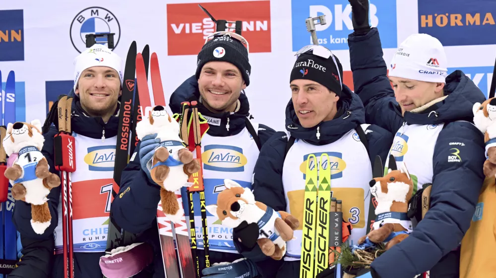 The winning French relay team from left, Emilien Claude, Fabien Claude, Quentin Fillon Maillet and Emilien Jacquelin celebrate on the podium after the men's relay 4 x 7.5 km at the Biathlon World Cup in Ruhpolding, Germany, Friday Jan. 17, 2025. (Sven Hoppe/dpa via AP)