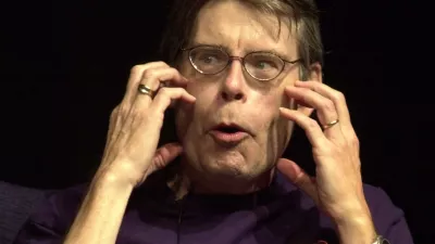 Horror author Stephen King gestures during a day long conference honoring the 1970 grad from the University of Maine in Orono, on campus Wednesday, Oct. 3, 2001. A panel of former classmates talked about a life of activism during the Vietnam War.(AP Photo/Pat Wellenbach)