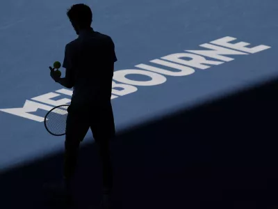 Daniil Medvedev of Russia prepares to serve to Kasidit Samrej of Thailand during their first round match at the Australian Open tennis championship in Melbourne, Australia, Tuesday, Jan. 14, 2025. (AP Photo/Ng Han Guan)