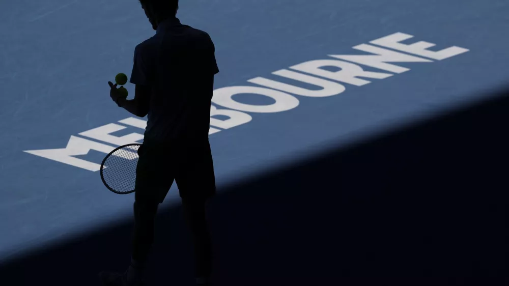 Daniil Medvedev of Russia prepares to serve to Kasidit Samrej of Thailand during their first round match at the Australian Open tennis championship in Melbourne, Australia, Tuesday, Jan. 14, 2025. (AP Photo/Ng Han Guan)