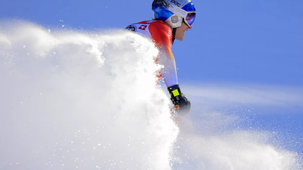 Switzerland's Marco Odermatt checks his time at the finish area of an alpine ski, men's World Cup downhill, in Wengen, Switzerland, Saturday, Jan. 18, 2025 (AP Photo/Giovanni Maria Pizzato)