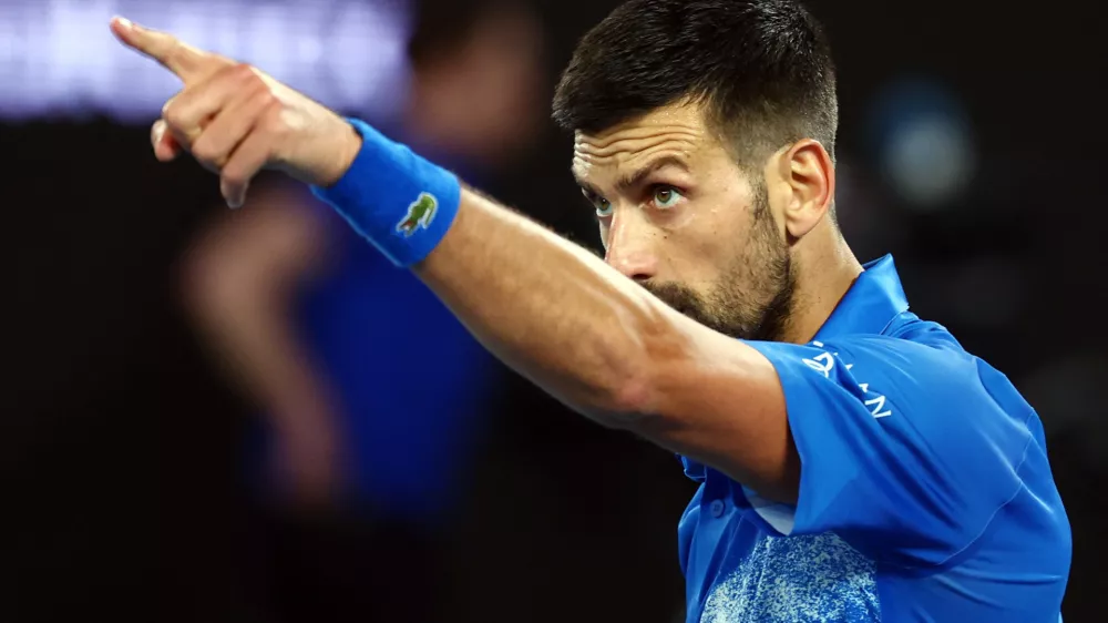 Tennis - Australian Open - Melbourne Park, Melbourne, Australia - January 17, 2025 Serbia's Novak Djokovic gestures as he celebrates winning his third round match against Czech Republic's Tomas Machac REUTERS/Edgar Su