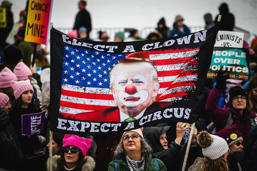 18 January 2025, US, Washington: Anti-Trump protestors hold signs and march through the streets of Washington DC for the Peoples March. Formerly the Women's March, People's Marches took place all across the United States, including a rally in Washington D.C., to protest the policies of the incoming Trump administration. Photo: Dave Decker/ZUMA Press Wire/dpa