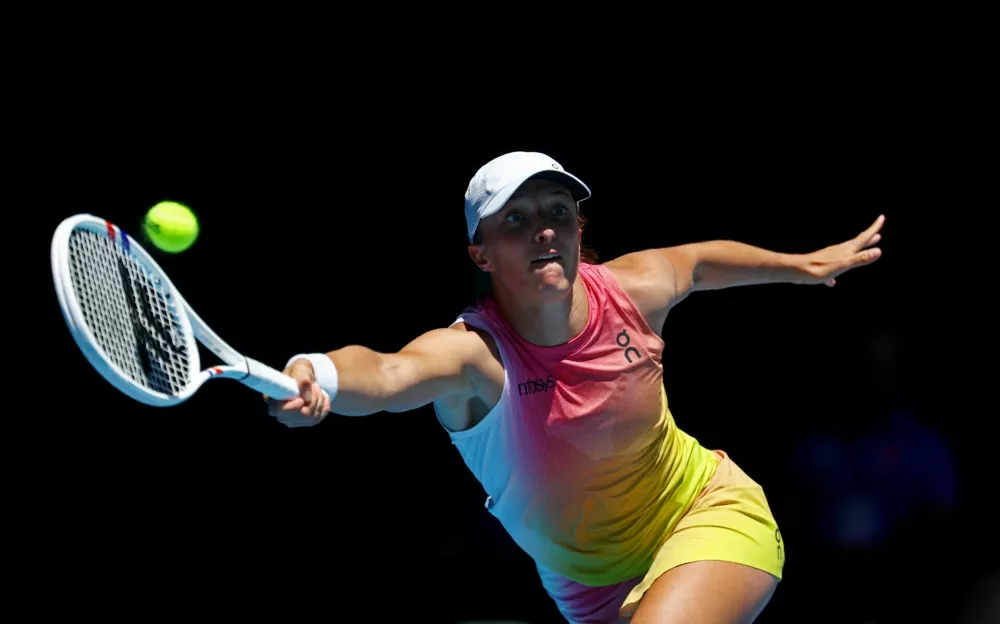 Tennis - Australian Open - Melbourne Park, Melbourne, Australia - January 18, 2025 Poland's Iga Swiatek in action during her third round match against Britain's Emma Raducanu REUTERS/Edgar Su