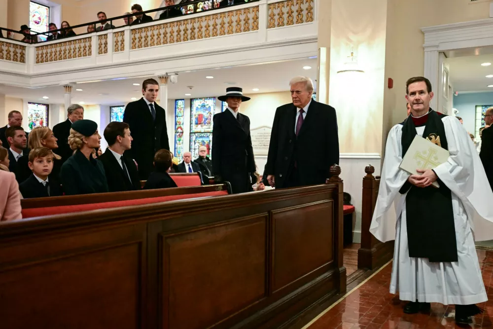 US President-elect Donald Trump, trailed by Melania Trump and son Barron Trump, arrives for a church service at St. John's Episcopal Church, Lafayette Square in Washington, DC, January 20, 2025.,Image: 955666000, License: Rights-managed, Restrictions:, Model Release: no