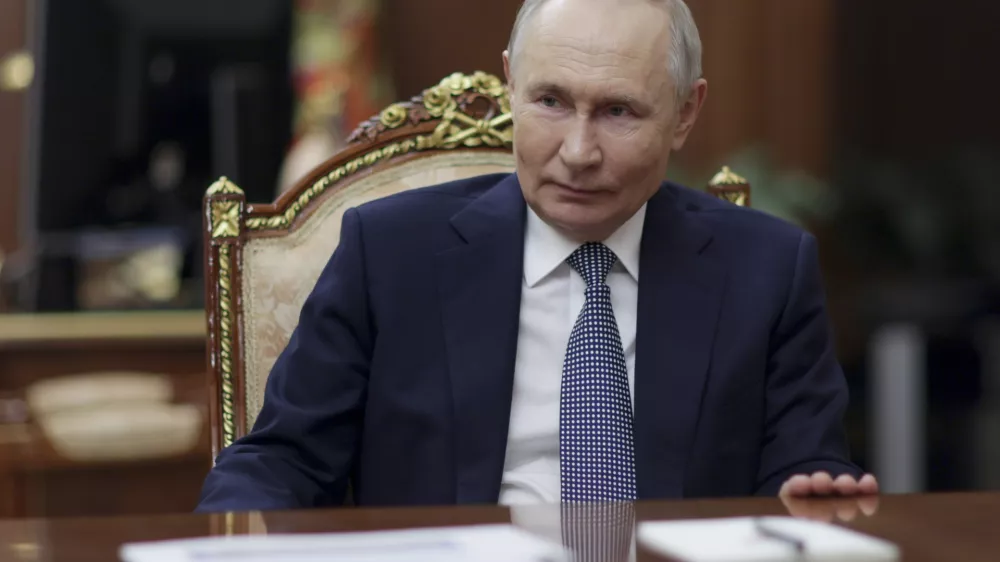 Russian President Vladimir Putin listens to President of the National Medical Research Centre for Endocrinology Ivan Dedov during their meeting at the Kremlin, in Moscow, Russia, on Saturday, Jan. 18, 2025. (Gavriil Grigorov, Sputnik, Kremlin Pool Photo via AP)