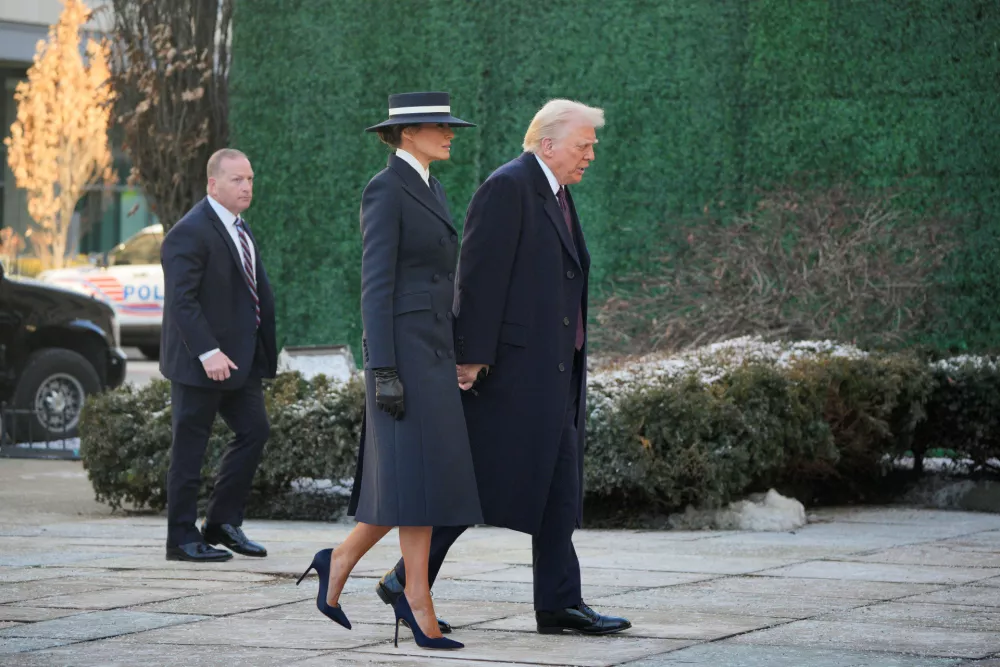 U.S. President-elect Donald Trump and his wife Melania Trump walk on the day of a service at St. John's Church on Inauguration Day of Donald Trump's second presidential term in Washington, U.S. January 20, 2025. REUTERS/Jeenah Moon