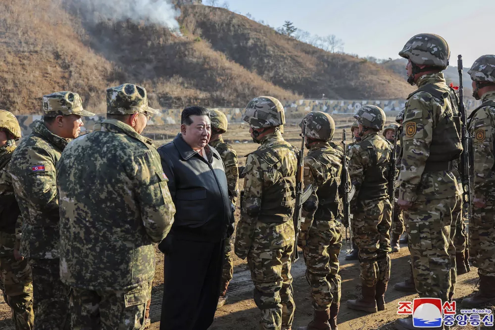 FILE - In this photo provided by the North Korean government, North Korean leader Kim Jong Un, center left, meets soldiers during a visit to a western operational training base in North Korea Wednesday, March 6, 2024. Independent journalists were not given access to cover the event depicted in this image distributed by the North Korean government. The content of this image is as provided and cannot be independently verified. Korean language watermark on image as provided by source reads: "KCNA" which is the abbreviation for Korean Central News Agency. (Korean Central News Agency/Korea News Service via AP, File)