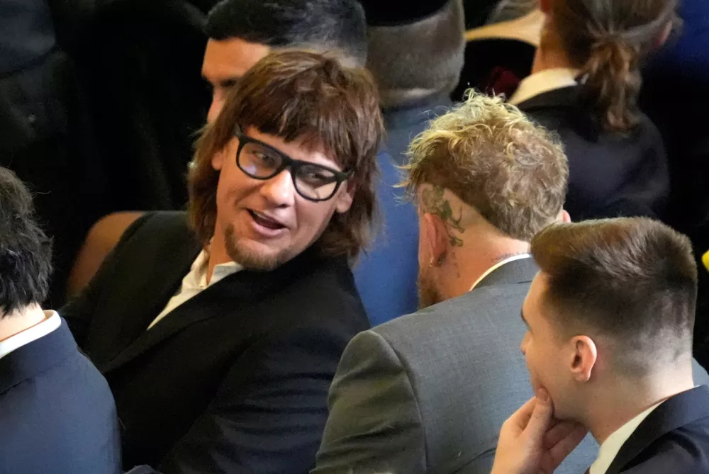 Comedian Theo Von speaks with boxer Jake Paul in the viewing area in the Emancipation Hall on the inauguration day of U.S. President-elect Donald Trump's second Presidential term in Washington, U.S. January 20, 2025. Jasper Colt/Pool via REUTERS