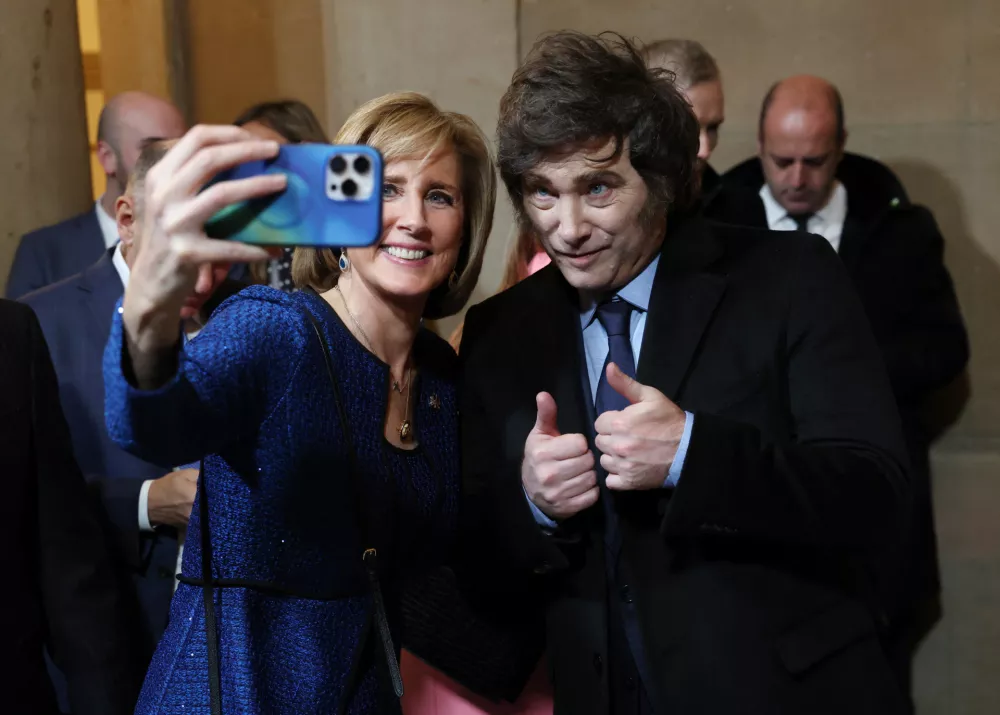 U.S. Representative (R-NY) Claudia Tenney and Argentina's President Javier Milei pose for a selfie ahead of the Presidential Inauguration of Donald Trump at the Rotunda of the U.S. Capitol in Washington, U.S. January 20, 2025. REUTERS/Evelyn Hockstein