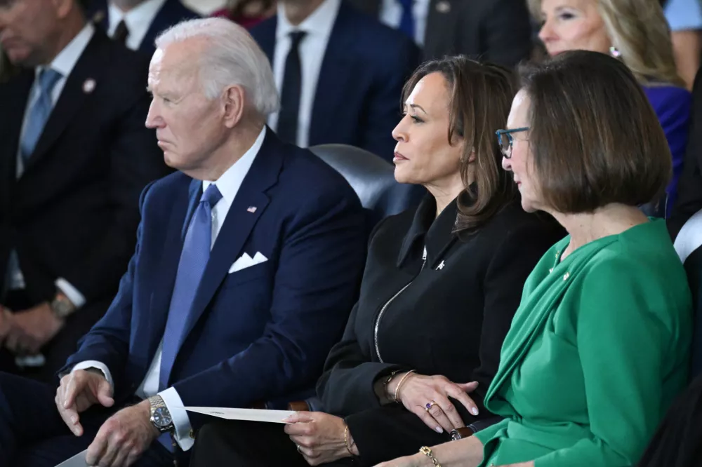 (L-R) US President Joe Biden and Vice President Kamala Harris attend the inauguration ceremony before Donald Trump is sworn in as the 47th US President in the US Capitol Rotunda in Washington, DC, on January 20, 2025.  SAUL LOEB/Pool via REUTERS