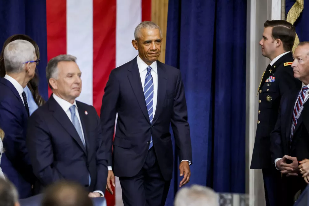 Former U.S. President Barack Obama walks as he attends Donald Trump's inauguration as the next President of the United States in the Rotunda of the United States Capitol in Washington, U.S., January 20, 2025. SHAWN THEW/Pool via REUTERS