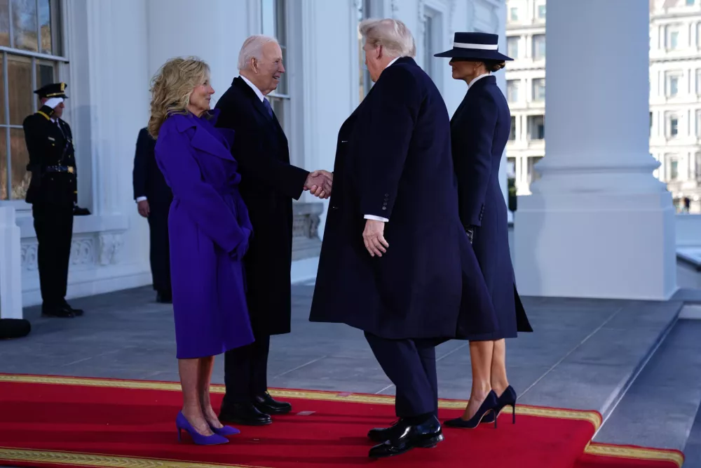 President Joe Biden (2L) and First Lady Dr. Jill Biden (L) greet President Elect Donald Trump (2R) and Melania Trump (R) at the White House during inauguration ceremonies for US President Donald Trump in Washington, DC, USA, 20 January 2025. Trump, who defeated Vice President Kamala Harris in the 2024 general election, is being sworn in today as the 47th president of the United States, though the planned outdoor ceremonies and events have been cancelled due to a forecast of extreme cold temperatures.