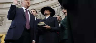 Donald Trump is sworn in as the 47th president of the United States by Chief Justice John Roberts as Melania Trump holds the Bible during the 60th Presidential Inauguration in the Rotunda of the U.S. Capitol in Washington, Monday, Jan. 20, 2025. (AP Photo/Morry Gash, Pool)