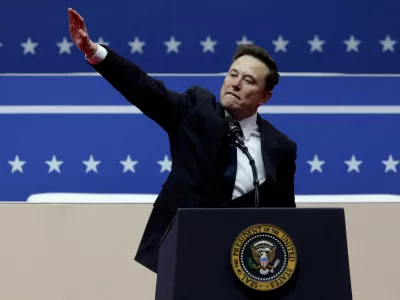 FILE PHOTO: Elon Musk gestures at the podium inside the Capital One arena on the inauguration day of Donald Trump's second presidential term, in Washington, U.S., January 20, 2025. REUTERS/Mike Segar/File Photo