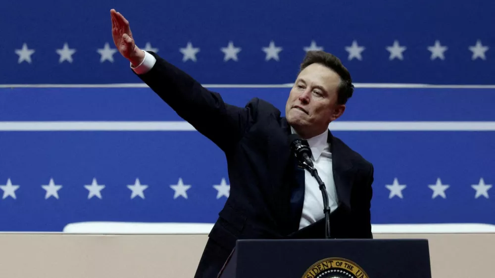 FILE PHOTO: Elon Musk gestures at the podium inside the Capital One arena on the inauguration day of Donald Trump's second presidential term, in Washington, U.S., January 20, 2025. REUTERS/Mike Segar/File Photo