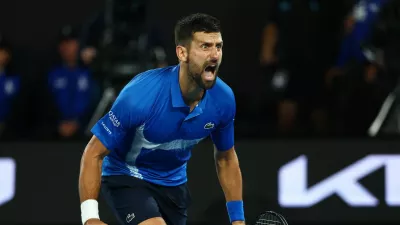 Tennis - Australian Open - Melbourne Park, Melbourne, Australia - January 22, 2025 Serbia's Novak Djokovic celebrates after winning his quarter final match against Spain's Carlos Alcaraz REUTERS/Edgar Su