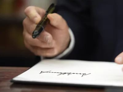 President Donald Trump signs executive orders in the Oval Office of the White House, Monday, Jan. 20, 2025, in Washington. (AP Photo/Evan Vucci)