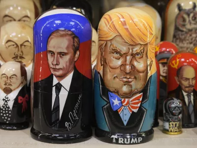 Traditional Russian wooden dolls called Matryoshka depicting Russian President Vladimir Putin, front left, and US President-elect Donald Trump, front right, are displayed for sale at a souvenir shop in St. Petersburg, Russia, Monday, Jan. 20, 2025. (AP Photo/Dmitri Lovetsky)