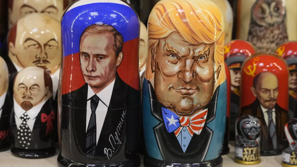 Traditional Russian wooden dolls called Matryoshka depicting Russian President Vladimir Putin, front left, and US President-elect Donald Trump, front right, are displayed for sale at a souvenir shop in St. Petersburg, Russia, Monday, Jan. 20, 2025. (AP Photo/Dmitri Lovetsky)