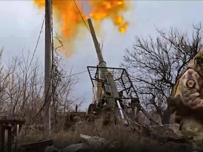 In this photo taken from video distributed by Russian Defense Ministry Press Service on Wednesday, Jan. 22, 2025, a Russian soldier fires a self-propelled gun "Malka" toward Ukrainian positions in an undisclosed location in Ukraine. (Russian Defense Ministry Press Service via AP)