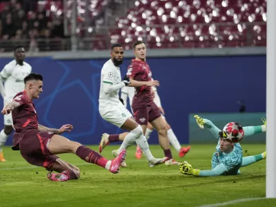 Leipzig's Benjamin Sesko scores his side's opening goal during the Champions League soccer match between RB Leipzig and Sporting CP at the RB Arena in Leipzig, Germany, Wednesday, Jan. 22, 2025. (AP Photo/Matthias Schrader)