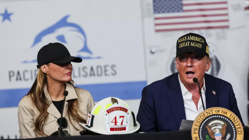 U.S. President Donald Trump and first lady Melania Trump attend a briefing on wildfire damage as they visit the Pacific Palisades neighborhood that was damaged by the Palisades Fire, in Los Angeles, California, U.S., January 24, 2025. REUTERS/Leah Millis