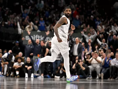 Jan 22, 2025; Dallas, Texas, USA; Dallas Mavericks guard Kyrie Irving (11) runs back up the court after making a three point shot against the Minnesota Timberwolves during the second half at the American Airlines Center. Mandatory Credit: Jerome Miron-Imagn Images