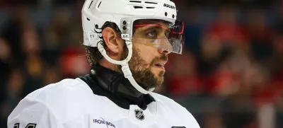 Jan 11, 2025; Calgary, Alberta, CAN; Los Angeles Kings center Anze Kopitar (11) during the face off against the Calgary Flames during the third period at Scotiabank Saddledome. Mandatory Credit: Sergei Belski-Imagn Images