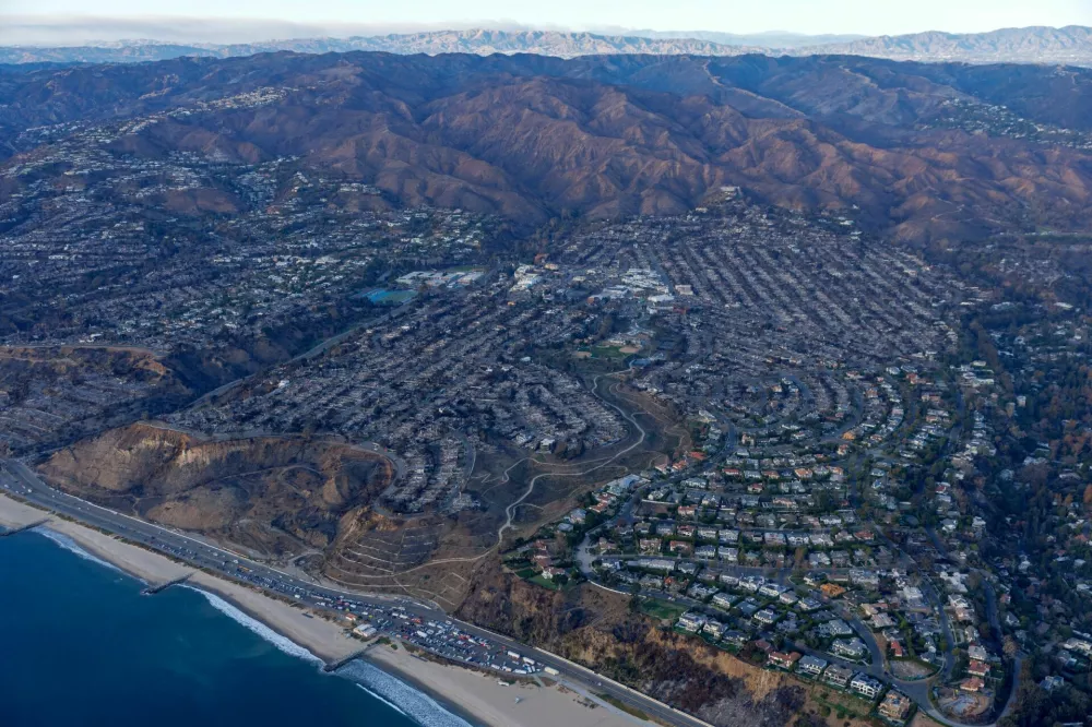 An aerial view of the fire damage caused by the Palisades Fire is shown in the Pacific Palisades neighborhood of Los Angeles, California, U.S. January 22, 2025. REUTERS/Mike Blake