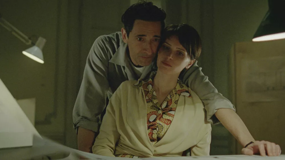 This image released by A24 shows Adrien Brody, left, and Felicity Jones in a scene from "The Brutalist." (A24 via AP)