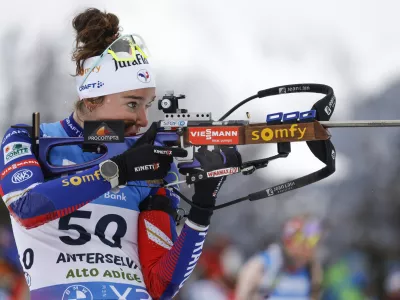 France's Lou Jeanmonnot at the shooting range, during a Biathlon women's World Cup 7.5km sprint race, in Anterselva, Italy, Thursday Jan. 23, 2025. (AP Photo/Alessandro Trovati)