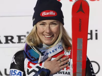 The winner United States' Mikaela Shiffrin celebrates after an alpine ski, women's World Cup slalom, in Are, Sweden, Sunday, March 10, 2024. (AP Photo/Alessandro Trovati)