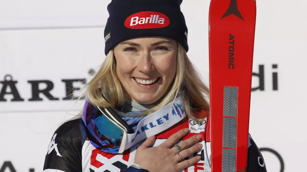 The winner United States' Mikaela Shiffrin celebrates after an alpine ski, women's World Cup slalom, in Are, Sweden, Sunday, March 10, 2024. (AP Photo/Alessandro Trovati)