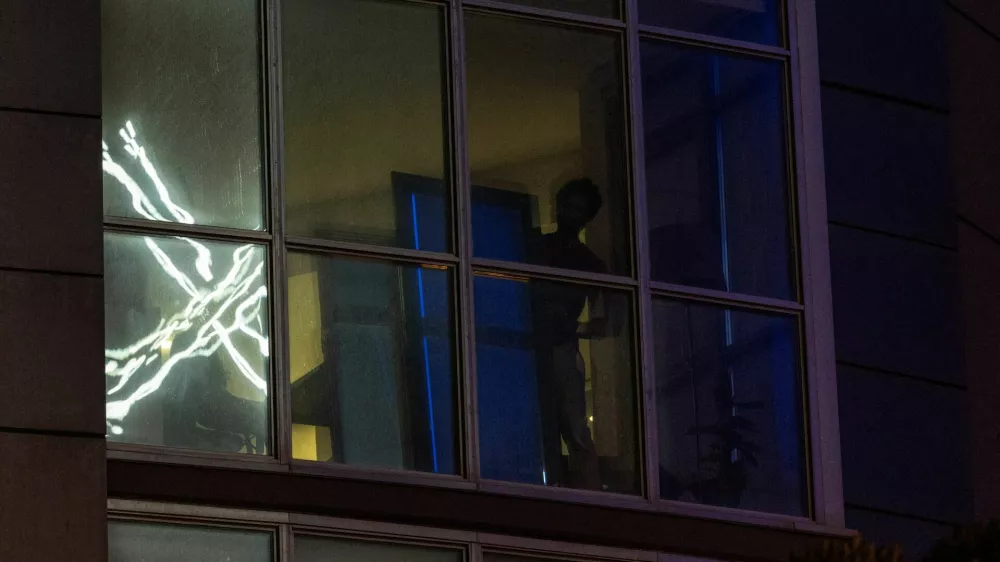 'X' logo is seen reflected on an apartment window across the street from the headquarters of the messaging platform X, formerly known as Twitter, in downtown San Francisco, California, U.S., July 30, 2023. REUTERS/Carlos Barria   TPX IMAGES OF THE DAY