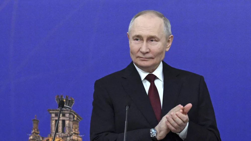 Russian President Vladimir Putin applauds while attending a ceremony to award the Order for Valiant Labour to the members of teaching staff during a meeting of the Board of Trustees of the Lomonosov Moscow State University in Moscow, Russia, Friday, Jan. 24, 2025. (Ramil Sitdikov, Sputnik, Kremlin Pool Photo via AP)