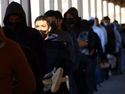 Migrants line up to leave the United States for Mexico after being deported across the Paso del Norte international border bridge, after U.S. President Donald Trump promised mass deportation operation, as seen from Ciudad Juarez, Mexico January 23, 2025. REUTERS/Jose Luis Gonzalez