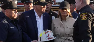 President Donald Trump and first lady Melania Trump talk with Los Angeles firefighters as they tour the Pacific Palisades neighborhood affected by recent wildfires in Los Angeles, Friday, Jan. 24, 2025. (AP Photo/Mark Schiefelbein)