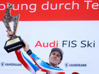 Alpine Skiing - FIS Alpine Ski World Cup - Men's Slalom - Kitzbuehel, Austria - January 26, 2025 France's Clement Noel celebrates with the trophy on the podium after winning the Men's Slalom REUTERS/Lisi Niesner