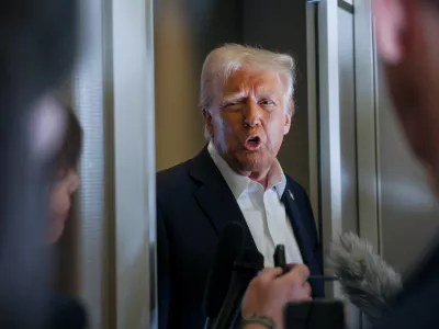 U.S. President Donald Trump speaks with reporters as they ask questions aboard Air Force One during a flight from Las Vegas, Nevada, to Miami, Florida, U.S., January 25, 2025. REUTERS/Leah Millis