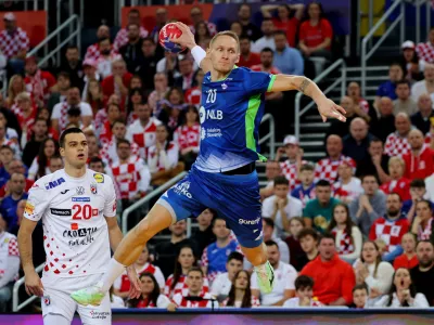 Handball - IHF Handball World Championships 2025 - Main Round IV - Croatia v Slovenia - Zagreb Arena, Zagreb, Croatia - January 26, 2025 Slovenia's Tilen Kodrin scores a goal REUTERS/Antonio Bronic