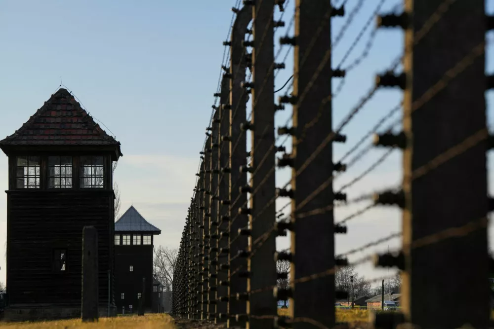 A barbed wire is seen at the site of the former Nazi German concentration and extermination camp Auschwitz-Birkenau prior to the 80th anniversary of the liberation of the camp in Brzezinka, Poland, January 26, 2025. REUTERS/Aleksandra Szmigiel