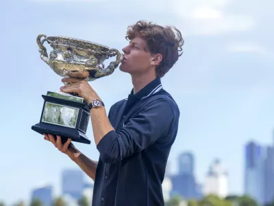 Jannik Sinner of Italy kisses Norman Brookes Challenge Cup the morning after defeating Alexander Zverev of Germany in the men's singles final at the Australian Open tennis championship in Melbourne, Australia, Monday, Jan. 27, 2025. (AP Photo/Mark Baker)