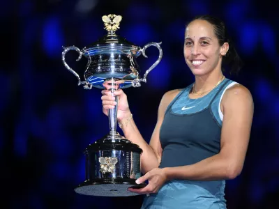 25 January 2025, Australia, Melbourne: US tennis player Madison Keys poses with the the Daphne Akhurst Memorial Cup after winning the Women's final against Belarusian tennis player Aryna Sabalenka during the 2025 Australian Open at Melbourne Park in Melbourne. Photo: Joel Carrett/AAP/dpa