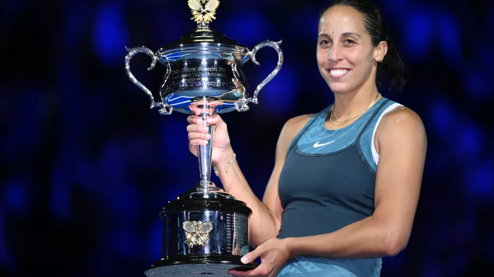 25 January 2025, Australia, Melbourne: US tennis player Madison Keys poses with the the Daphne Akhurst Memorial Cup after winning the Women's final against Belarusian tennis player Aryna Sabalenka during the 2025 Australian Open at Melbourne Park in Melbourne. Photo: Joel Carrett/AAP/dpa