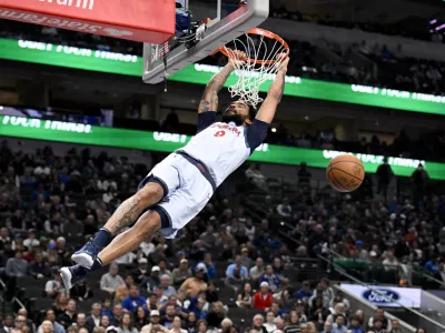 Jan 27, 2025; Dallas, Texas, USA; Washington Wizards forward Justin Champagnie (9) dunks the ball against the Dallas Mavericks during the game at the American Airlines Center. Mandatory Credit: Jerome Miron-Imagn Images