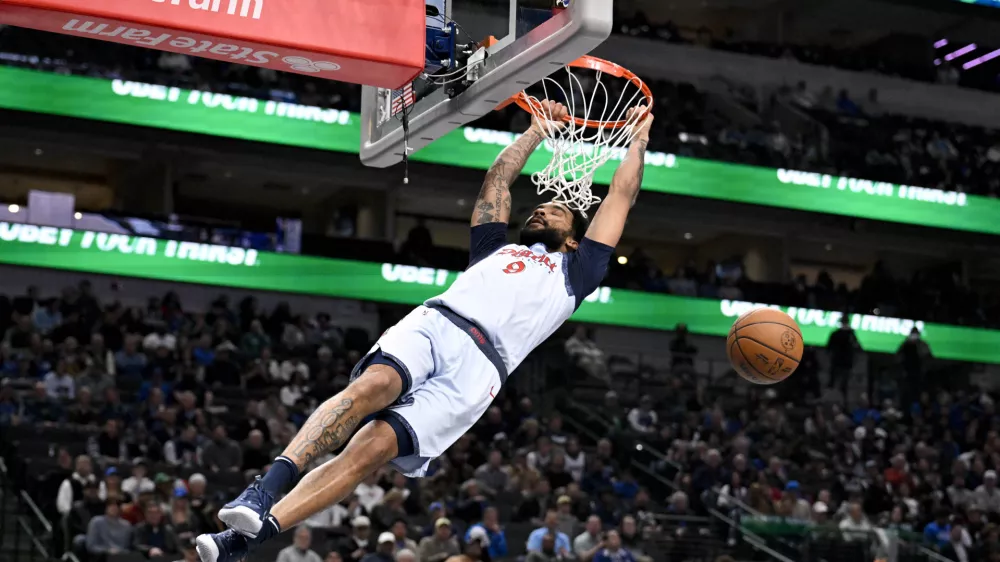 Jan 27, 2025; Dallas, Texas, USA; Washington Wizards forward Justin Champagnie (9) dunks the ball against the Dallas Mavericks during the game at the American Airlines Center. Mandatory Credit: Jerome Miron-Imagn Images