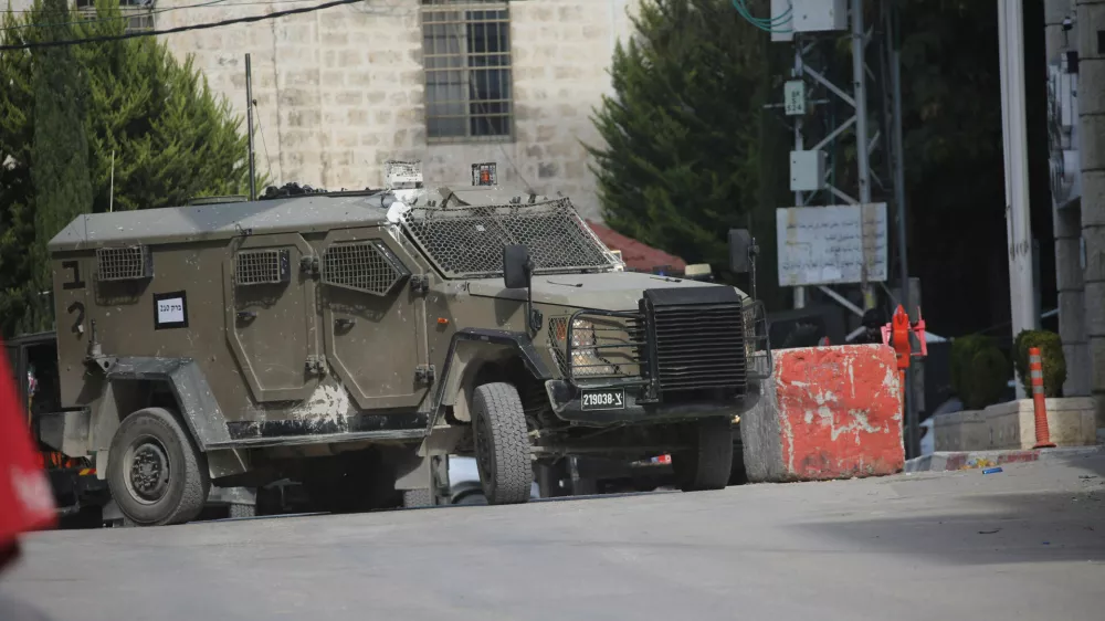 28 January 2025, Palestinian Territories, Tulkarem: Israeli military vehicle pictured on the second day of an Israeli military raid at Tulkarem refugee camp, near the West Bank city of Tulkarem. At least two Palestinians were killed and a dozen injured in the Israeli military raid in Tulkarem and its camp, according to the Palestinian Ministry of Health. Photo: Mohammed Nasser Apaimages/APA Images via ZUMA Press Wire/dpa